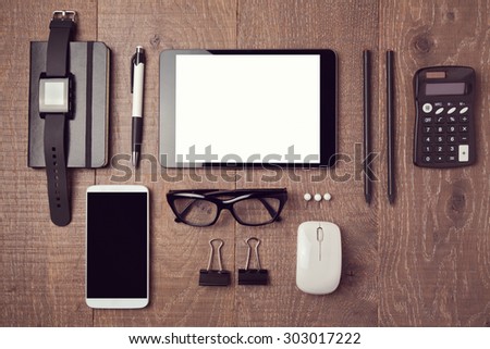 Modern office desk with gadgets. View from above