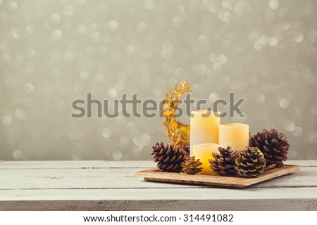 Christmas decorations with candles and pine corn