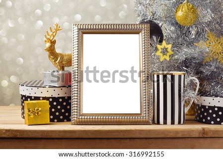 Christmas poster mock up template with Christmas tree and gift boxes. Black, golden and silver decorations