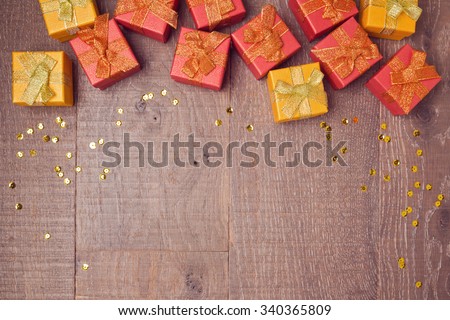 Background with gift boxes on wooden table. Sale and discount concept. View from above