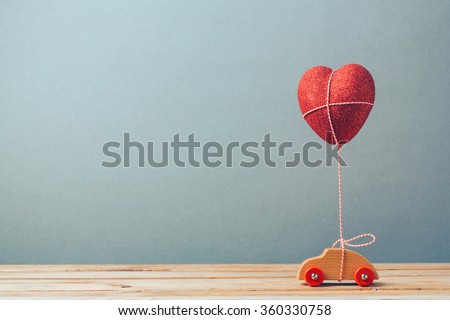Valentine\'s day holiday celebration with toy car and heart shape