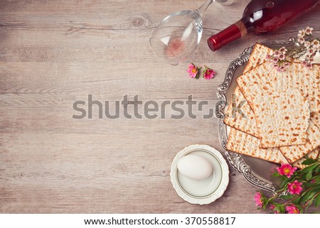Passover background with matzah, seder plate and wine. View from above