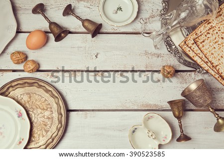 Jewish holiday Passover background with plates. View from above. Flat lay