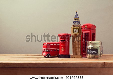 Travel to Great Britain concept with souvenirs and money box jar. Planning summer vacation, money budget trip concept.
