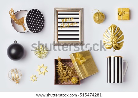 Christmas decorations, ornaments and objects in black and gold for mock up template design.View from above. Flat lay