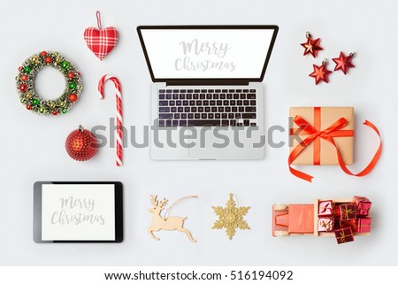 Christmas decorations, laptop computer and objects for mock up template design.View from above. Flat lay