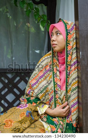 Beautiful Muslim Malay woman in an outdoor park