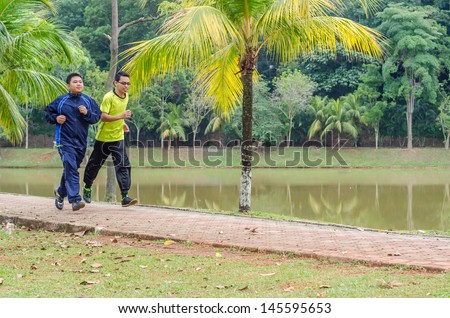 Two Young man jogging in park