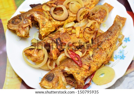 Fried fish with onions