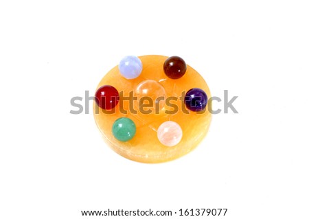 Group of natural colorful gemstones on star of david isolated on the white background.