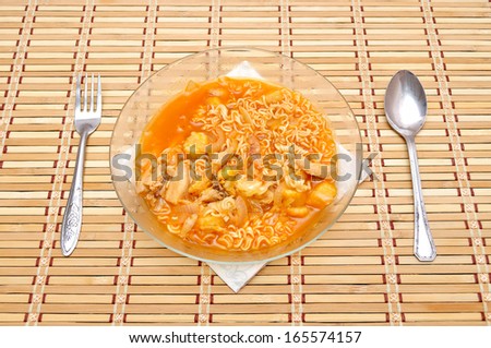 Fast food noodles with fork and spoon