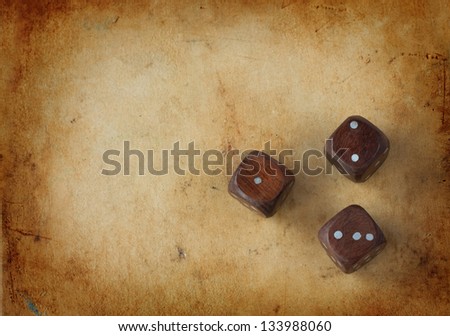 Three wooden dices on a vintage background - bad luck concept with free text space