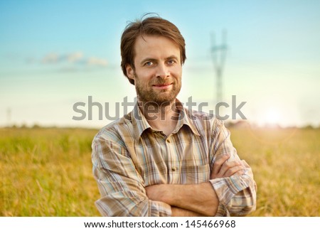 Happy Smiling Caucasian Forty Years Old Farmer Standing Proud In Front Of His Wheat Fields
