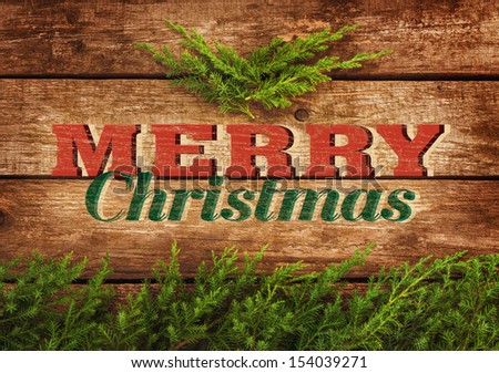 Merry Christmas vintage postcard or poster design  - old planked wood board with pine tree branch