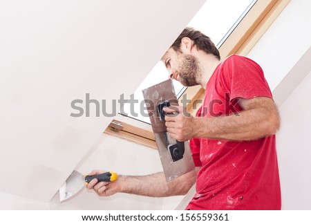 Forty Years Old Good Looking Caucasian Manual Worker With Wall Plastering Tools Inside A House