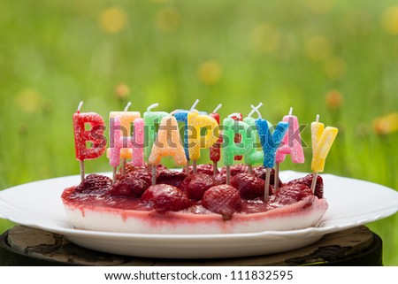 Strawberry Happy birthday cake with candles