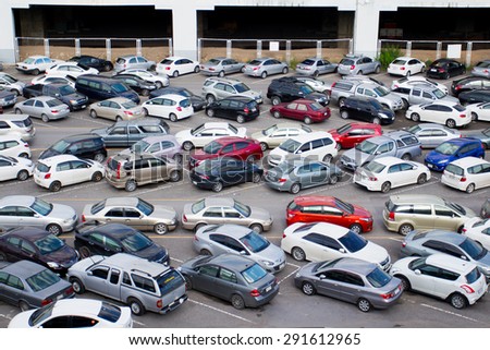 BANGKOK- JUNE  28 :Cars parked at a park and side lot at a BTS station in Chatuchak district on June 28,2015 in Bangkok,Thailand.The government has promoted park and ride to reduce traffic congestion.