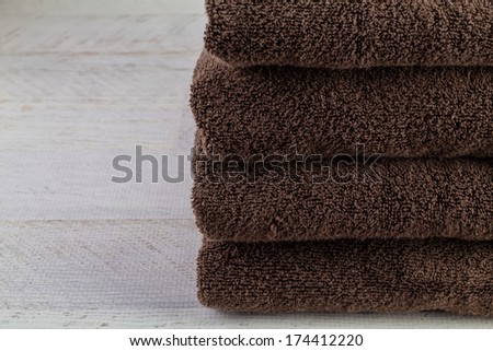 Pile of brown, organic cotton towels.