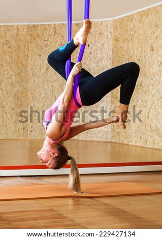 Woman doing antigravity Aerial yoga