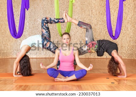 Yoga practicing. Women practicing yoga at health club