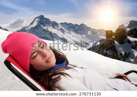 Beautiful woman enjoying winter mountains. Winter Scenic in the French Alps, Les 2 Alpes