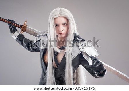 Fantasy woman warrior. Woman warrior with sword and armor isolated on the gray background