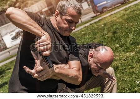 Kapap instructor demonstrates self defense techniques against a gun