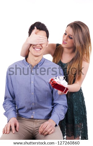 Young couple: Woman give present to her man