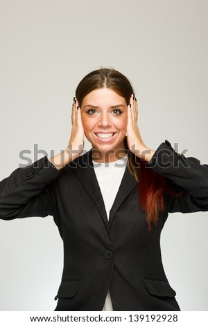 Young happy business woman ears covered gesture on white background