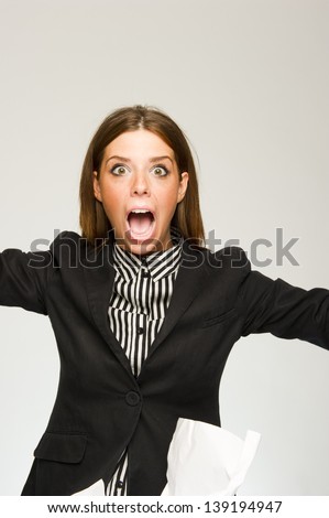 Young scared business woman screaming on white background