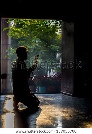 A man pray buddha