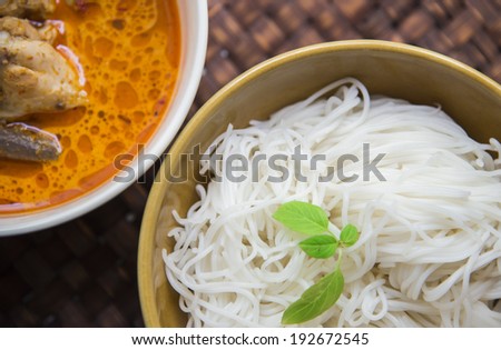 Thai rice vermicelli with Green Chicken Curry on weaving mat