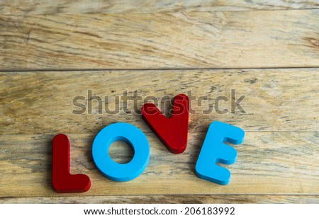 Colorful wooden word Love on wooden floor