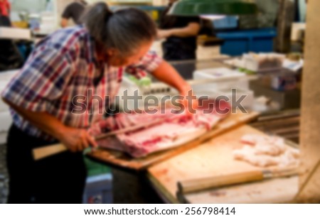 Fish merchant is cutting fish in Blur style