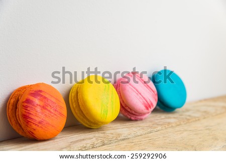 Colorful macaron with white background on wooden floor