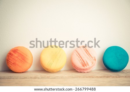 Colorful macaron with white background on wooden floor in Vintage style