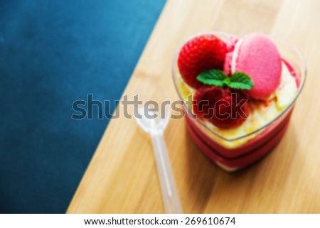 Strawberry moose cake with macaron on wooden plate in Blur style