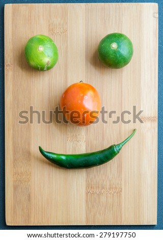 Vegetable face on chopping block