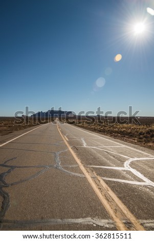 Drive along the road with sun burst and lens flare