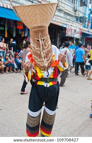 LOEI PROVINCE,THAILAND-JULY 23:Unidentified man wears ghost costumes at Ghost Festival (Phi Ta Khon - a masked procession celebrated by Buddhist) at Dan Sai district in Loei Province on July 23, 2012.