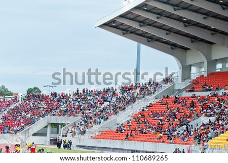 CHIANG MAI, THAILAND -  JULY 28: the crowd in a stadium watching a football match at Chiang Mai Stadium: Muang Thong United vs. TTM Chiang Mai on July 28, 2012 in Chiang Mai Province,Thailand