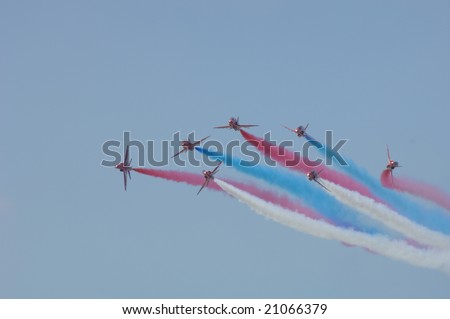 FAIRFORD, UK - JULY 16: RAF Red Arrows perform a Vixen break at the Royal International Air Tattoo on July 16, 2005 in Fairford, UK.