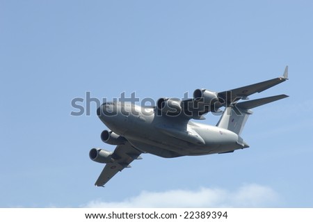FAIRFORD, UK - JULY 16: RAF C-17 transport performing a high speed pass during an air demonstration atthe Royal International Air Tattoo on July 16, 2005 in Fairford, UK.
