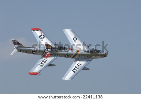 VIRGINIA BEACH, VA - SEPT 17: Two Korean War F-86 performs a high speed pass during the NAS Oceana airshow on September 17, 2005 in Virginia Beach, VA.