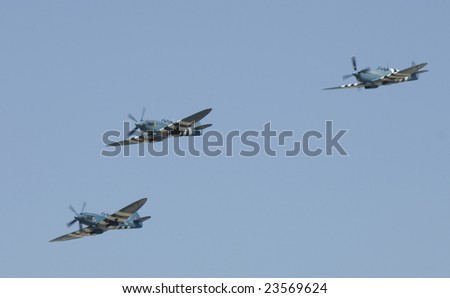 FAIRFORD, UK - JULY 16, 2005: World War II British Spitfire 3 ship performs a high speed pass at the Royal International Air Tattoo on July 16, 2005 in Fairford, UK.