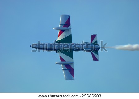 FAIRFORD, UK - JULY 16: Italian Frecce Tricolori solo rolls his jet past vertical during a display at the Royal International Air Tattoo on July 16, 2005 in Fairford, UK.