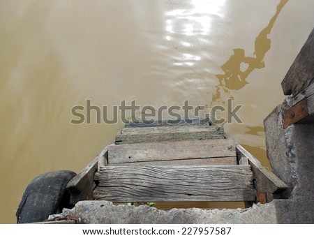 old wooden ladder to river,Thailand