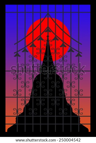 Silhouette of pagoda on the sunset behind wrought iron window
