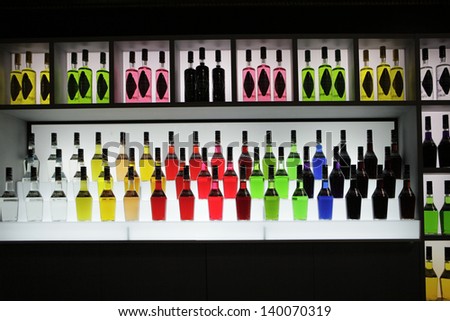 MILAN, ITALY - MAY 22: Bottles with different vivid colors exposed in Tuttofood, Milano World Food Exhibition on May 22, 2013 in Milan, Italy