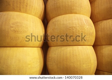 MILAN, ITALY - MAY 22: closeup of wheels of parmigiano reggiano, Tuttofood, Milano World Food Exhibition on May 22, 2013 in Milan, Italy